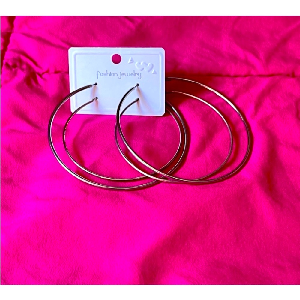 A Set of Two different-sized bangle earrings